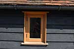 European oak flush casement with oak cheek detail to cladding