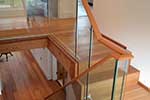 custom handrail profile on frameless glass balustrade