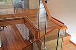custom handrail profile on frameless glass balustrade